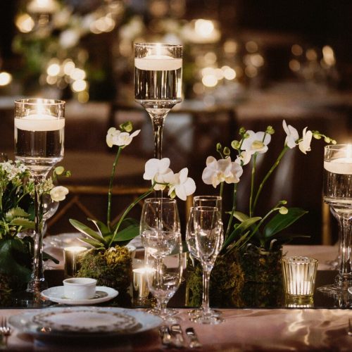 decorated-table-with-orchids-candles-glasses-light_8353-9915